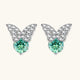 Sterling silver butterfly stud earrings with crystal wings and mint green center stones on cream background.
